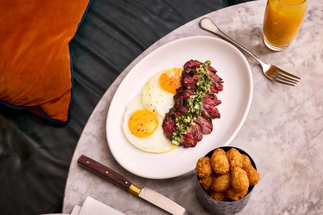 a plate of breakfast food with eggs and meat at King Street Townhouse Hotel & Spa in Manchester