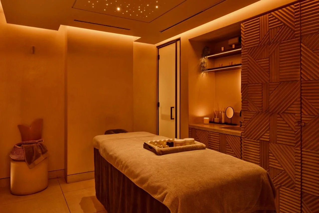 a room with a bed in a room with a closet at King Street Townhouse Hotel & Spa in Manchester